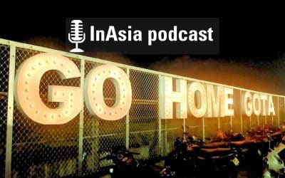 A lit up neon sign that reads, "Go Home Gota" with a graphic that reads, "InAsia podcast."