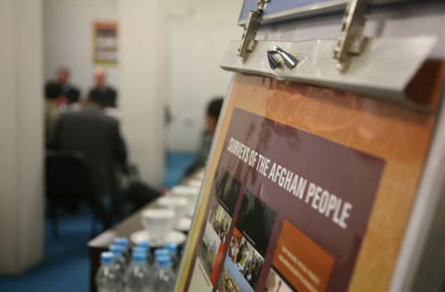 AGimage5 A poster in the conference room depicting the covers of the five Afghanistan surveys published by The Asia Foundation since 2004.