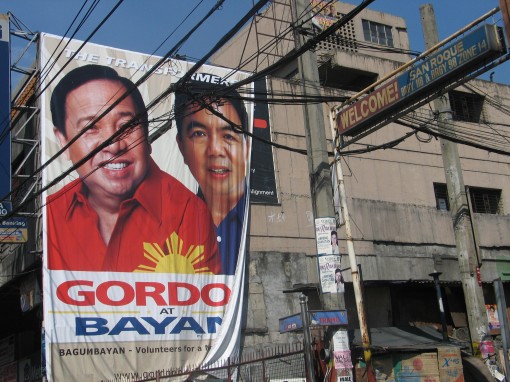 An election campaign poster covers the side of building in Manila. 