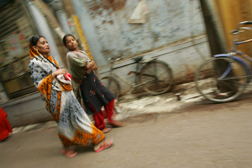 India 2009 - Karl Grobl Women walk along a street in India.