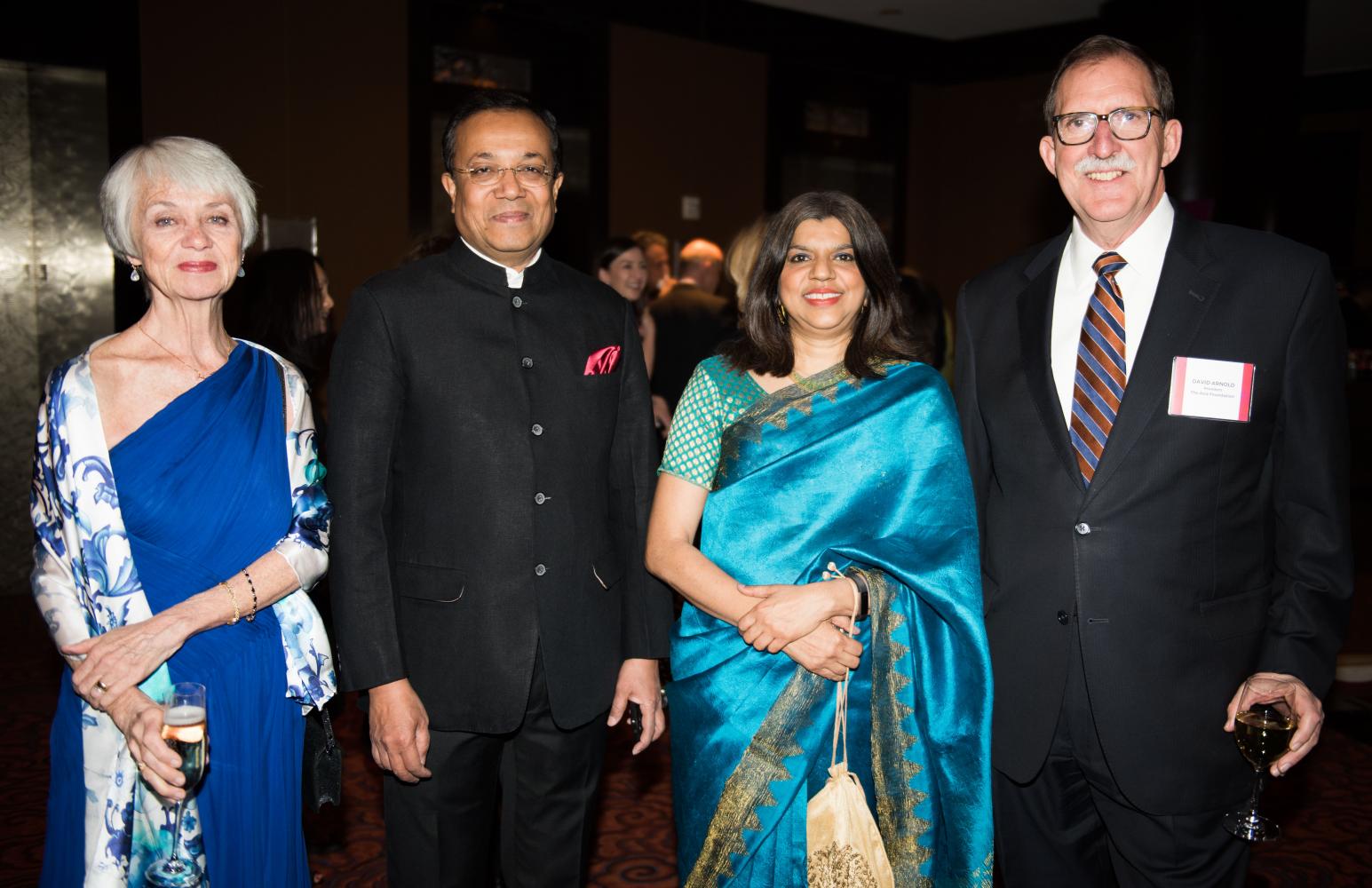 Sherry Arnold, Ashish Basu, Dr. Kalpana Viswanath, and David Arnold smile for photo.