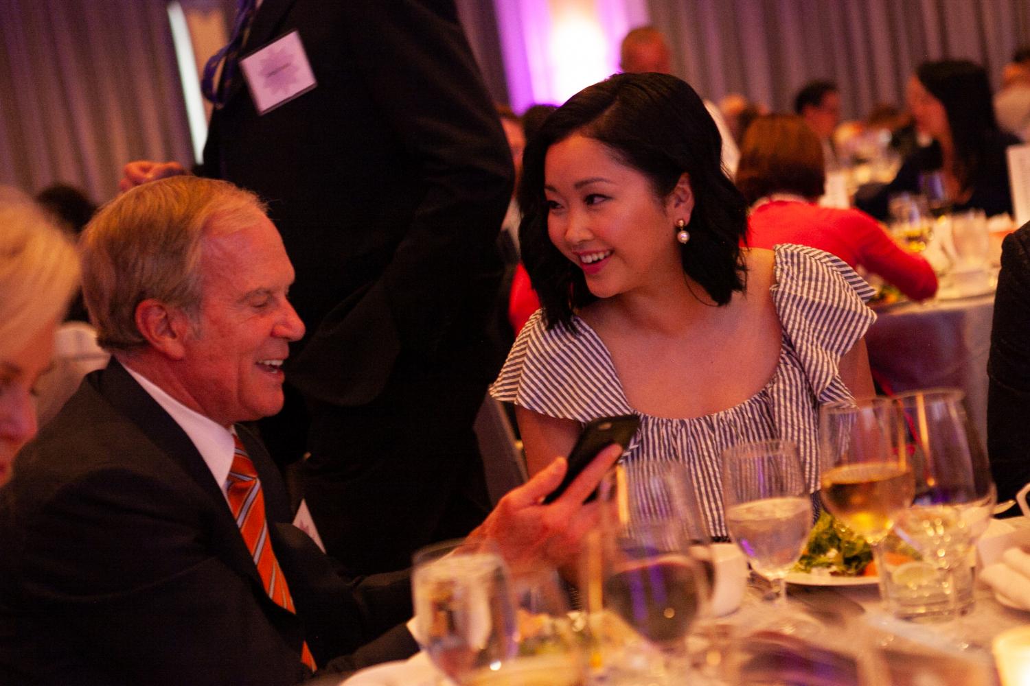 Jerome Dodson shows Lana Condor something on his phone