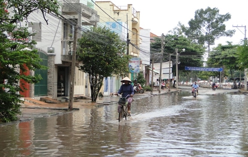 Bicyclist in flood water