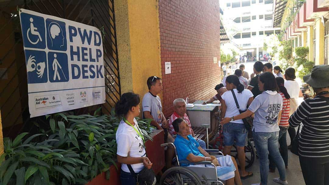 PWDs in line to vote at an Emergency Accessible Polling Place in Abellana National High School in Cebu City.