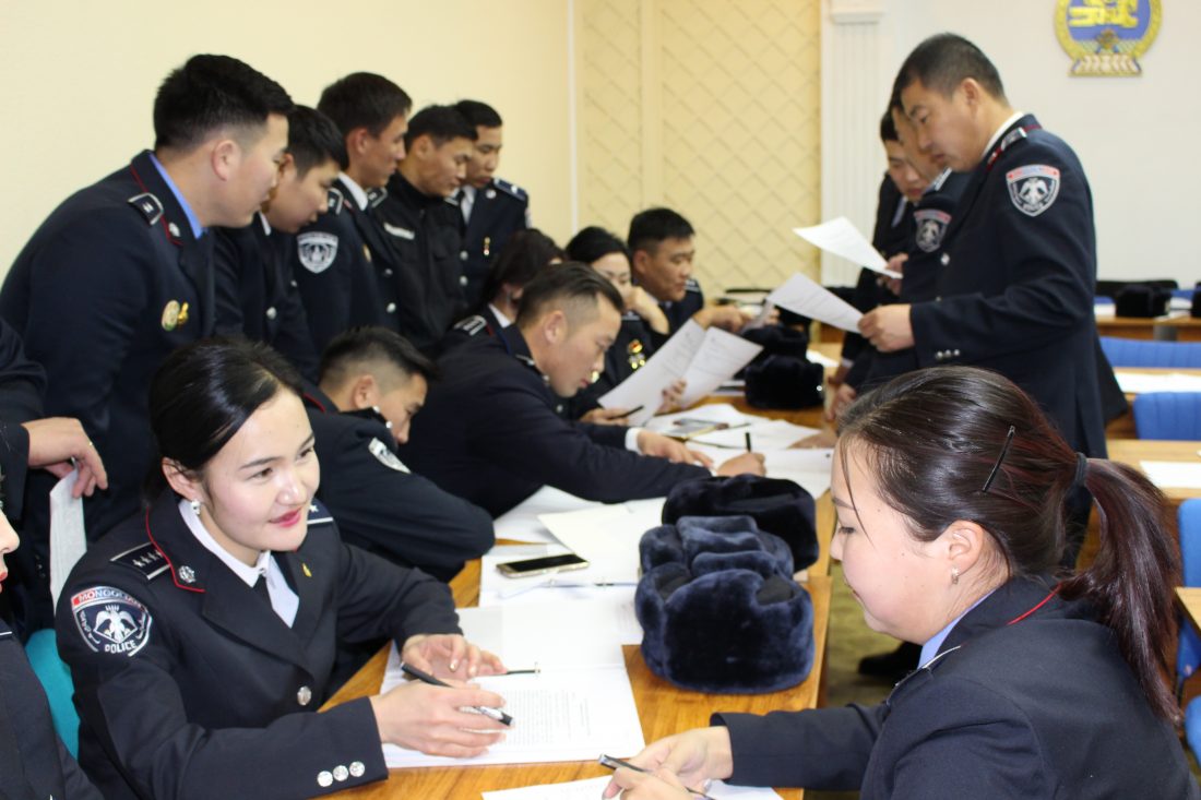 Police and cadets participate in a training session to equip them with the skills and knowledge of how to respond to and manage domestic violence situations. 