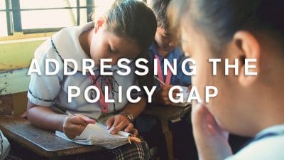 thumbnail for supplemental video, reading "Addressing the Policy Gap"