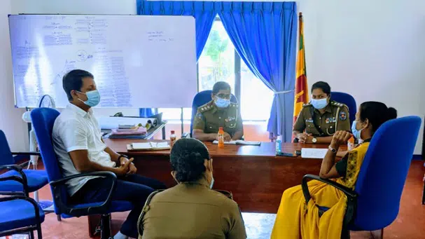 people sitting around a desk