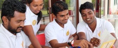 Young students review a brochure