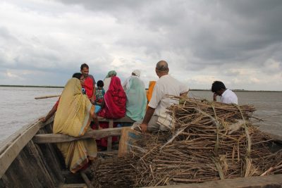 People aboard a boat on during a flood