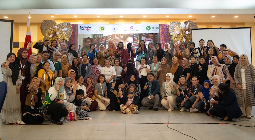 Dozens of participants pose to commemorate the event