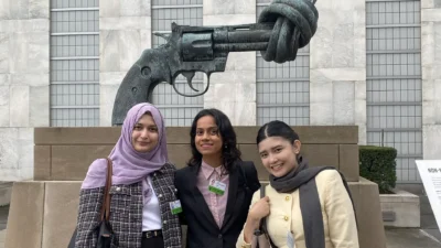 2025 William P. Fuller Fellows in front of The Knotted Gun sculpture, NYC