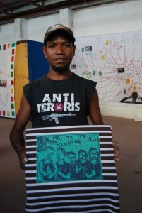 Mahatu, a Member of the Gembel Art Collective, Holding Up his New Printed T-shirt from the Printmaking Workshop in Dili.