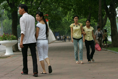 Young couples walk in Hanoi