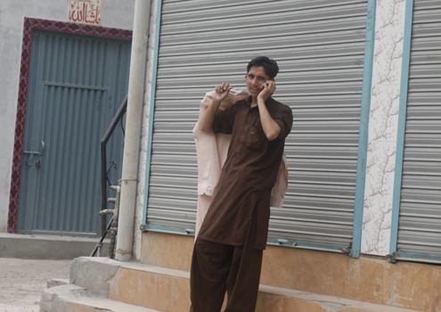 Daily life shots A man speaks on his cell phone in Lahore