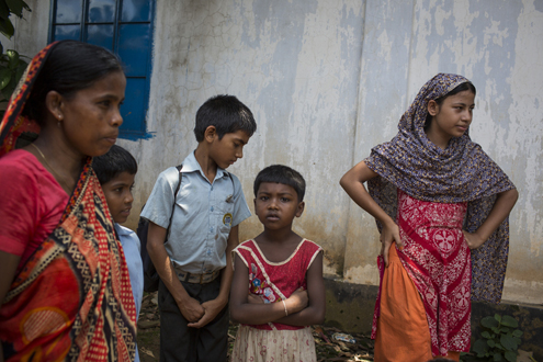 Bangladesh July 2012: Ashulia School of Hope On the outskirts of Dhaka, Ashulia is home to nearly half a million garment workers. Students from School of Hope meet their parents after school.