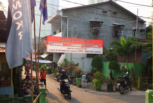 A banner in the Central Jakarta district of Tanah Abang encourages local residents to vote in a smooth, safe and orderly fashion.