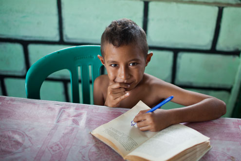 Timor boy reading